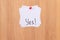 YES - White Sticky Notes with Written Word YES, Pinned to the Wooden Message Board