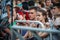 Yessentuki, Stavropol Territory / Russia - August 12, 2017: crowd of fans at the concert outdoors behind fence