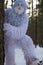 Yeti fairy tale character in winter forest. Outdoor fantasy photo.