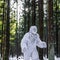 Yeti fairy tale character in winter forest. Outdoor fantasy photo.