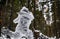 Yeti fairy tale character in winter forest. Outdoor fantasy photo.