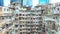 Yick Cheong and Yick Fat old apartment house exterior architecture in Hong Kong city, drone aerial view