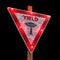 Yield street sign isolated on black background