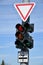 Yield traffic sign and lights at the road crossing