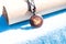 Yin Yang pendant necklace brown color handmade shoot outside in a sunny day closeup. Selective Focus