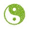 Yin Yang symbol with green leaves