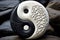 Yin yang symbol of harmony and balance on stone background