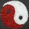 Yin Yang symbol made from red pepper and salt