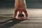 Yoga apprentice practicing sirsasana, inverted posture with the head resting on the floor