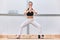 yoga asana in forty-year-old blonde woman with good looking and sporty style clothes