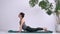 Yoga Assana training. Exercises to stretch and strengthen your back muscles. Attractive adult girl performs exercises
