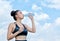 Yoga athlete woman drinking water after work out