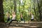 Yoga and balance practitioners training in forest