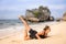 Yoga Bali. Caucasian woman practicing Salabhasana Variation B, Stag Locust Pose on the beach. Outdoor work out. Fit body woman.