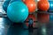Yoga ball and roller wheel for abs exercising in fitness gym., Close-up of roller fitness equipment on flooring ., Healthy and