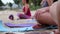 Yoga on the beach. Close-up of girls legs in lotus position. Blurred background for signature. Doing sports, Pilates, stretching o