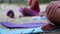 Yoga on the beach. Close-up of girls legs in lotus position. Blurred background for signature. Doing sports, Pilates, stretching o