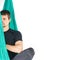 Yoga calm fly pose at hammock. Lotus asana at studio training. Man seated at mat