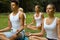 Yoga Class. Group of People Meditating At Summer Park