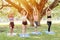 Yoga class outdoor, Group of healthy people practice and learning way of peace for health in the park
