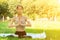 Yoga class in park,sports and fitness outdoor,young woman in nature does exercises, trains