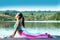 Yoga. Cobra pose.Beautiful girl in the pose of a cobra is engaged in yoga on the background of beautiful nature.Healthy lifestyle