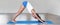 Yoga downward dog stretching pose girl practicing yoga indoors on exercise mat at fitness gym panoramic header banner