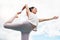 Yoga exercise woman and bow balance, stretching and outdoor fitness, wellness and mindfulness on cloud blue sky