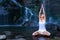 Yoga exercises near waterfall