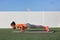 Yoga fitness woman practicing chaturanga pose push ups or press up on exercise mat at outdoor home. Fit and healthy young girl
