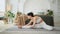 Yoga fitness workout training. Woman practicing stretching yoga at home. Woman doing sports exercise on yoga mat on