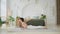 Yoga fitness workout training. Woman practicing yoga at home. Woman doing sports exercise on yoga mat on floor indoor