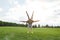 Yoga flexibility. Young healthy couple doing acro yoga on a grass in sunny morning. Healthy lifestyle. Various yoga