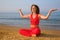 Yoga girl on beach