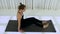 Yoga girl bends back up lying
