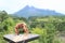 Yoga - girl on viewpoint to Merapi volcano