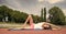 Yoga helps find harmony. Woman flexible body practice yoga lay fitness mat outdoors nature background. Girl stretching