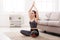 Yoga at home, woman do lotus pose
