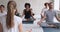 Yoga instructor and diverse people meditating seated in lotus position