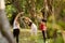 Yoga Instructor Exercising With Pregnant Women In Park