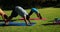 Yoga instructor instructing children in performing exercise