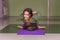 Yoga learner performs yoga asana in a studio