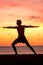 Yoga man training and meditating in warrior pose
