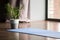 Yoga mat on the floor, blue carpet