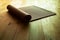 Yoga mat on natural wood floor with sunlight relaxation activity sport when stay at home