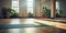 A yoga mat placed on the floor of an empty yoga class, ready for practitioners to use during their yoga sessions