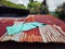 A yoga mat on top of rusty metal roof. Stock photo.