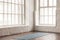 Yoga mat on wooden floor in empty room in yoga studio