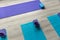 Yoga mats with blocks and belts placed on floor in studio