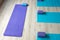 Yoga mats with blocks placed on floor in studio